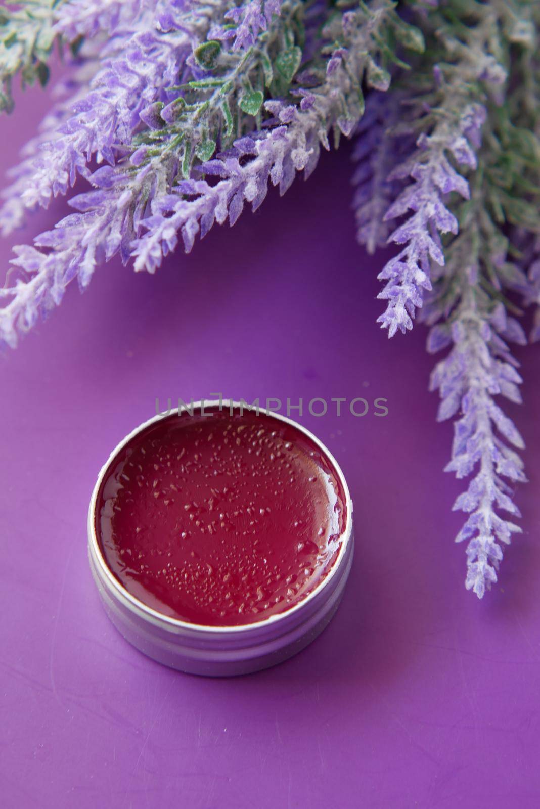 purple color petroleum jelly in a container by towfiq007