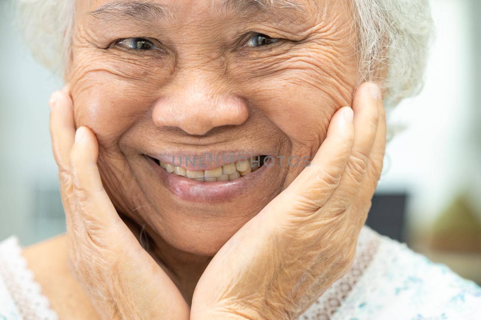 Asian senior or elderly old woman patient use denture and smile in nursing hospital ward, healthy strong medical concept by pamai