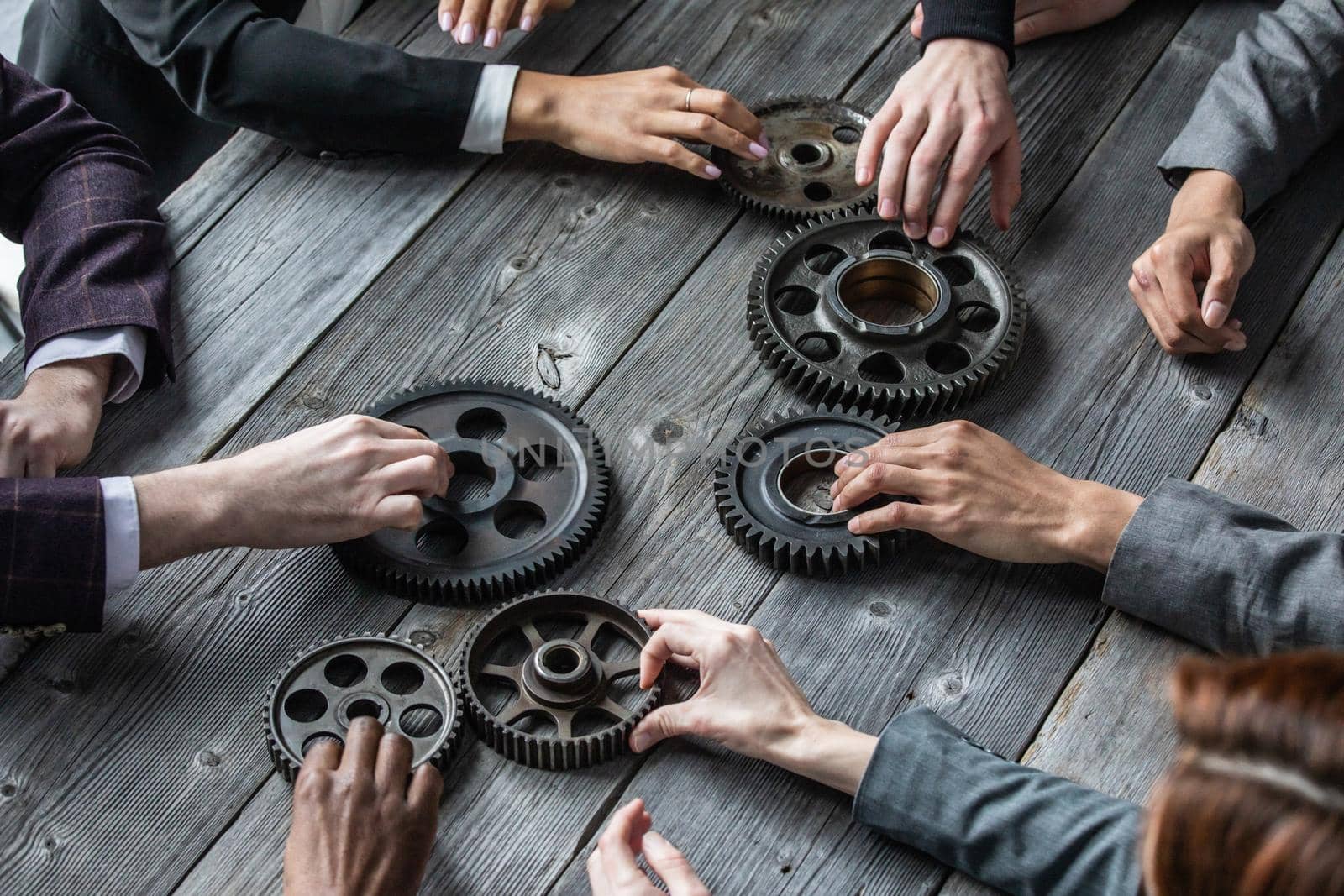 People with gear cogs of business teamwork cooperation concept