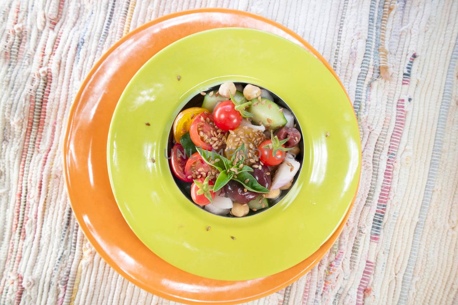 Photo shoot of the colorful and refreshing Mediterranean salad, a complete dish based on seasonal vegetables shown here in the vegan version