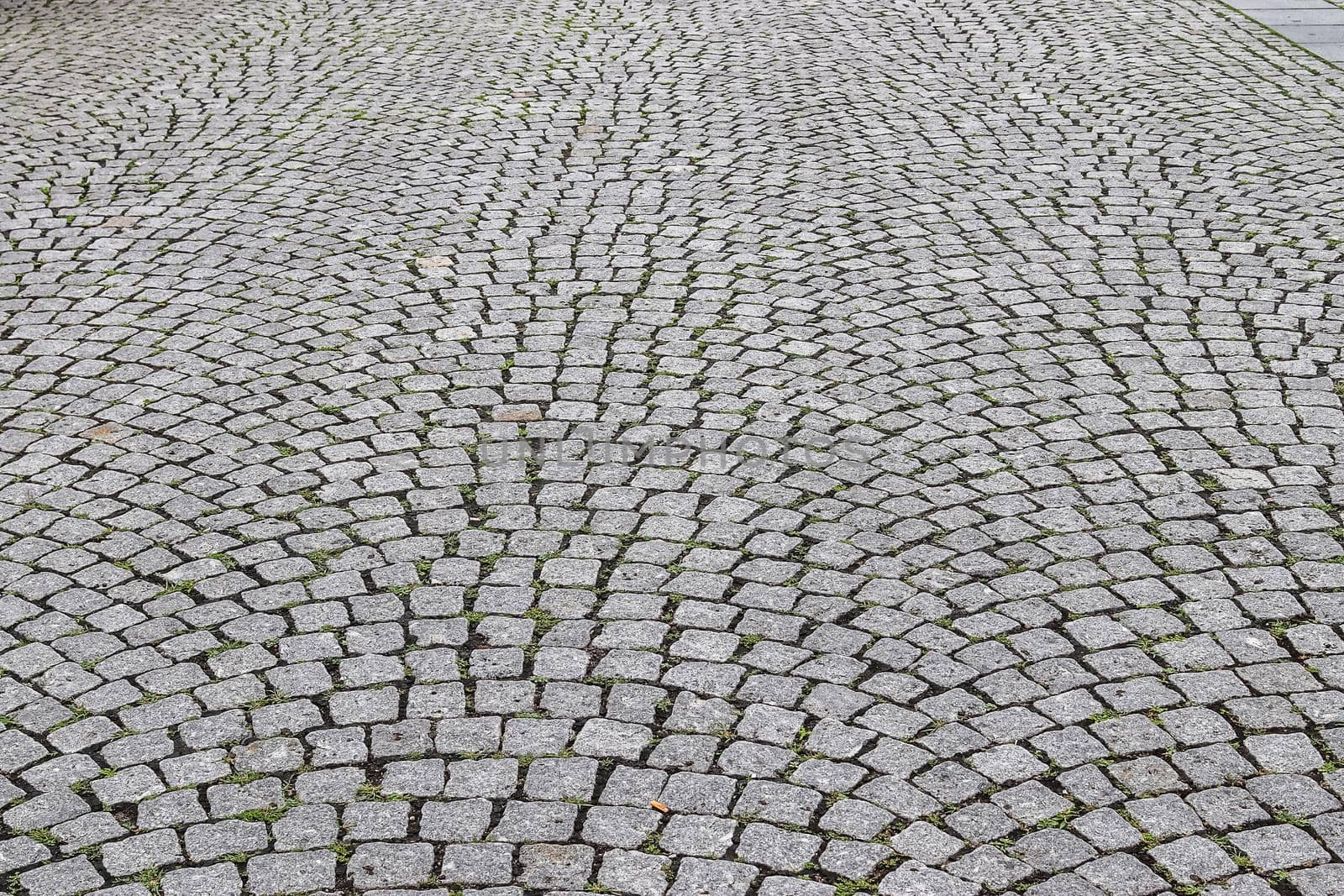 Close up view on old historical cobblestone roads and walkways all over europe