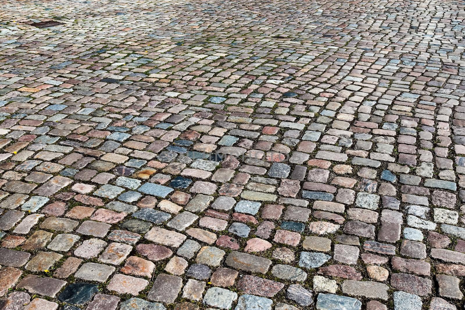 Close up view on old historical cobblestone roads and walkways all over europe