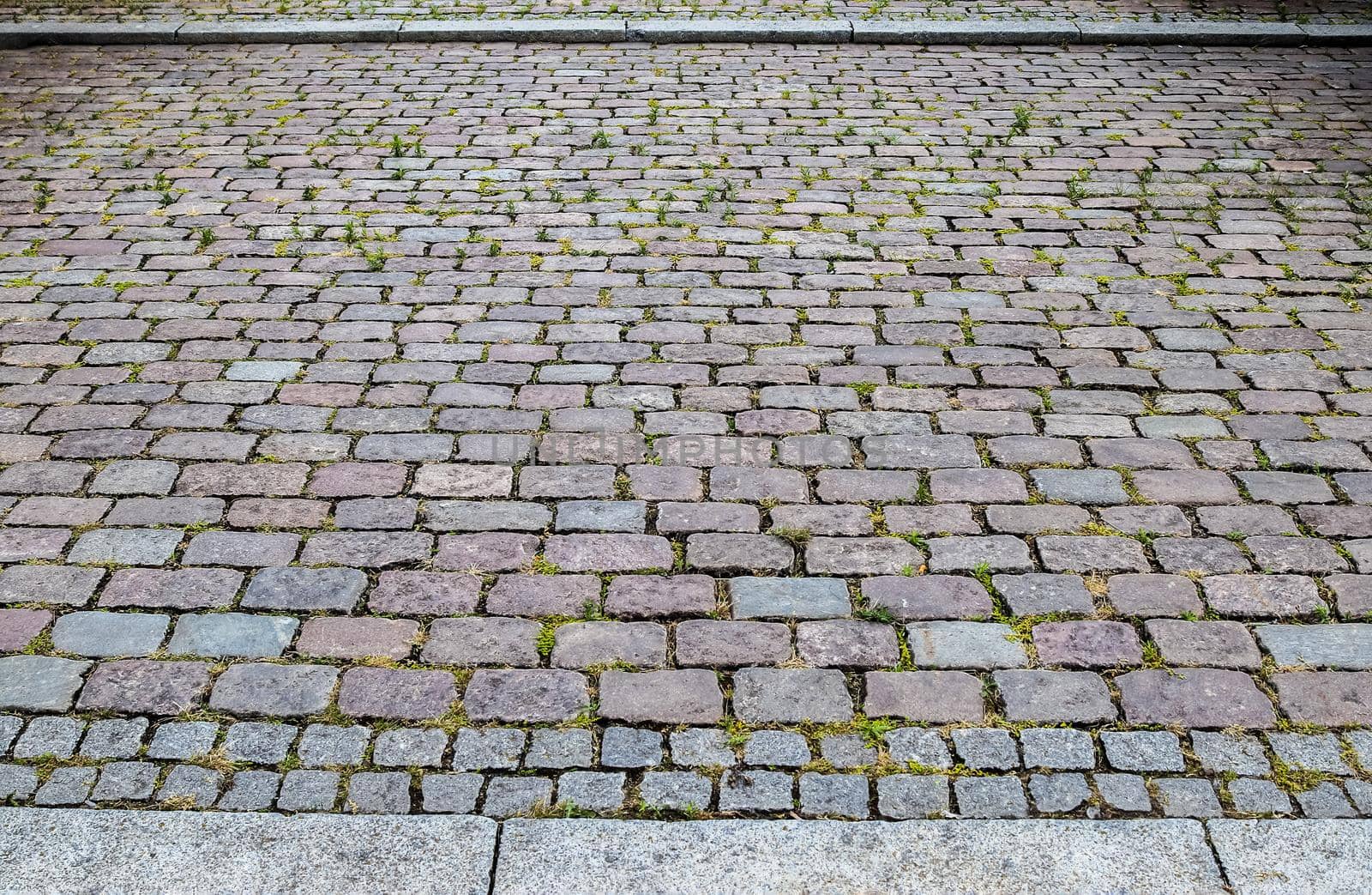 Close up view on old historical cobblestone roads and walkways all over europe by MP_foto71