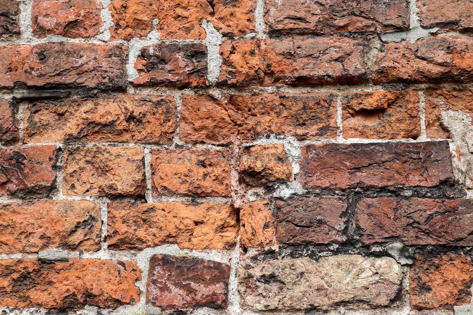 Old red rick wall. Texture of old weathered brick wall panoramic background.