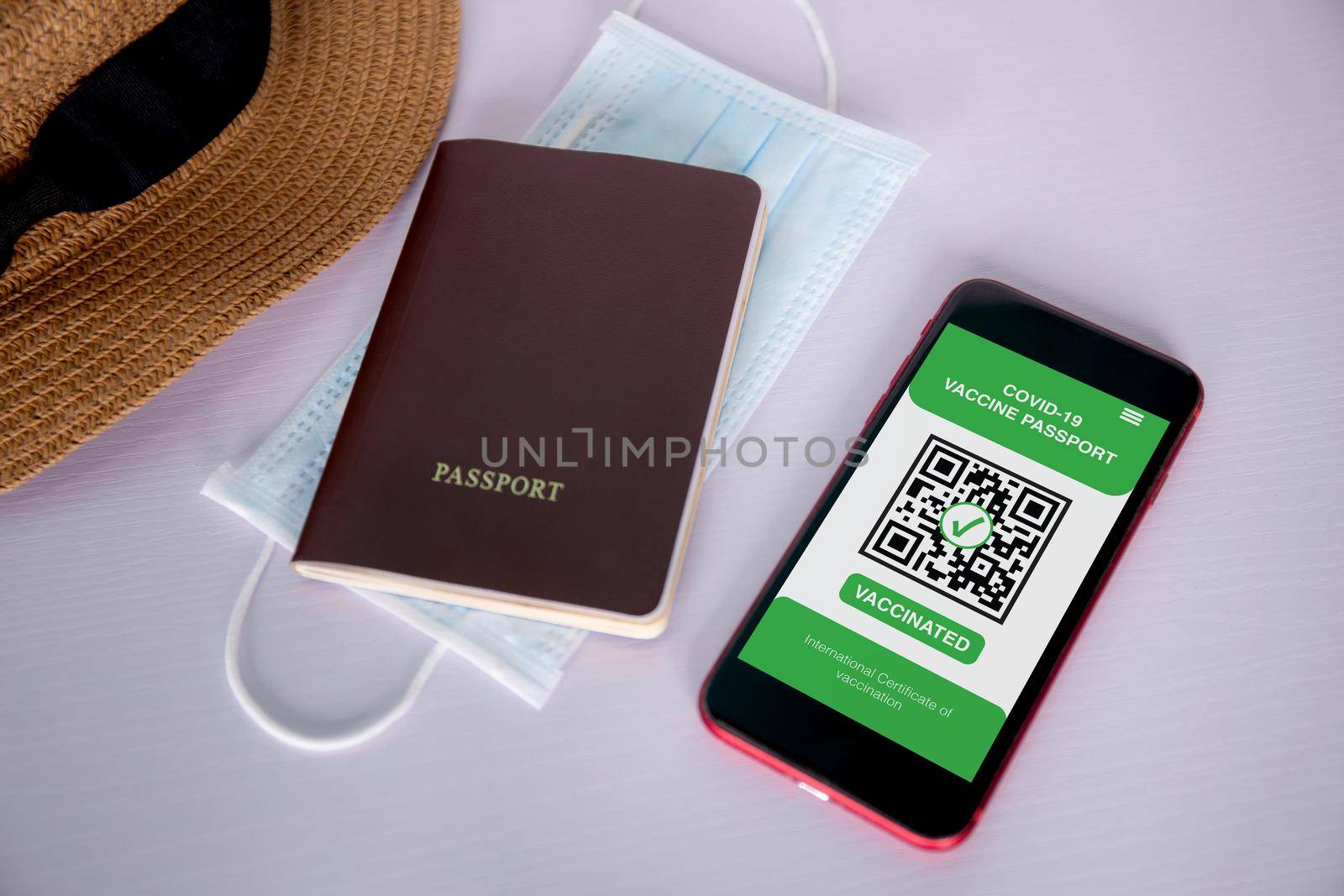 Vaccine passport, health vaccinated of covid-19 on app with mobile smart phone on desk, vaccination for immune with travel, certificate for safety of tourist, scan signing for smartphone for tourism. by nnudoo
