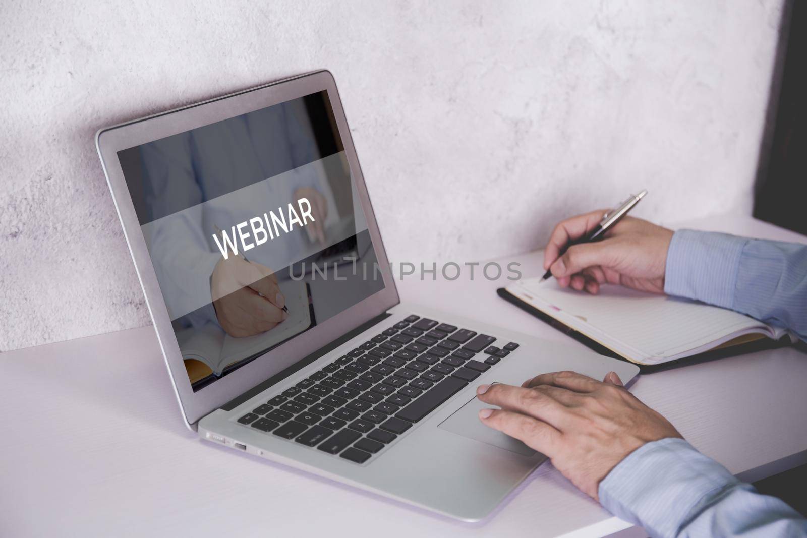 Hand of man watching webinar on laptop computer and writing on notebook for learning, education with e-learning online, video conference and training, seminar course, knowledge and study with digital.