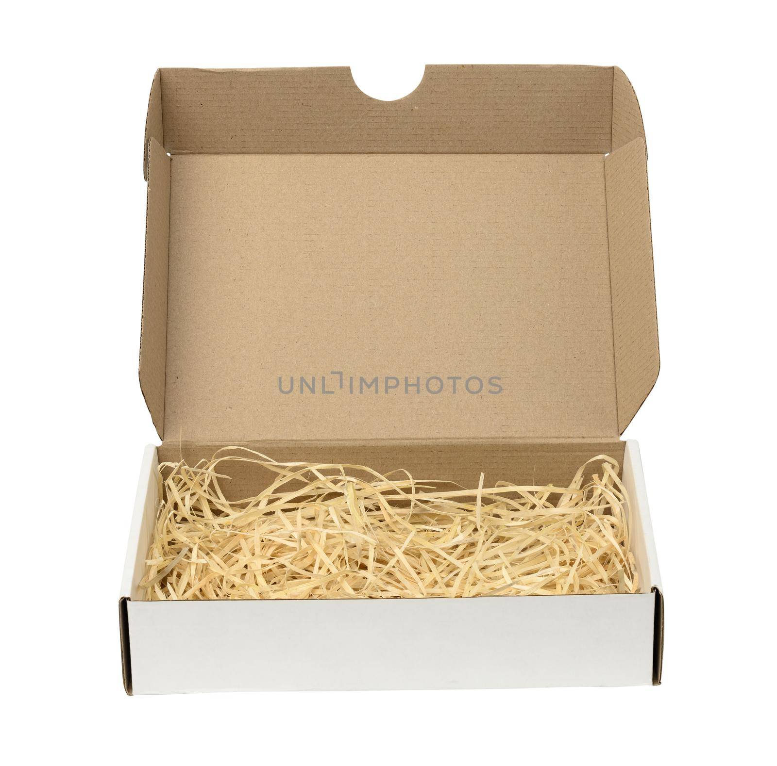 rectangular open corrugated paper box with sawdust inside. Packaging, containers for transportation