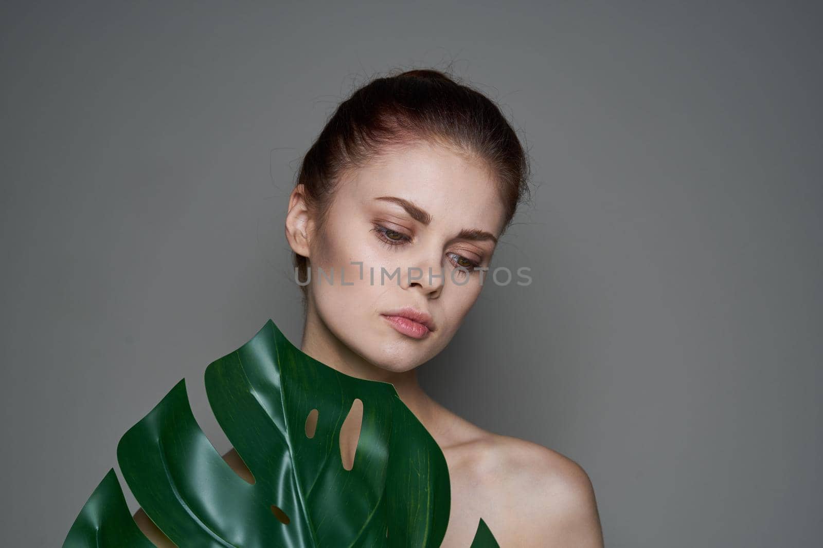 beautiful woman clean skin palm leaf health cosmetics spa treatments by Vichizh