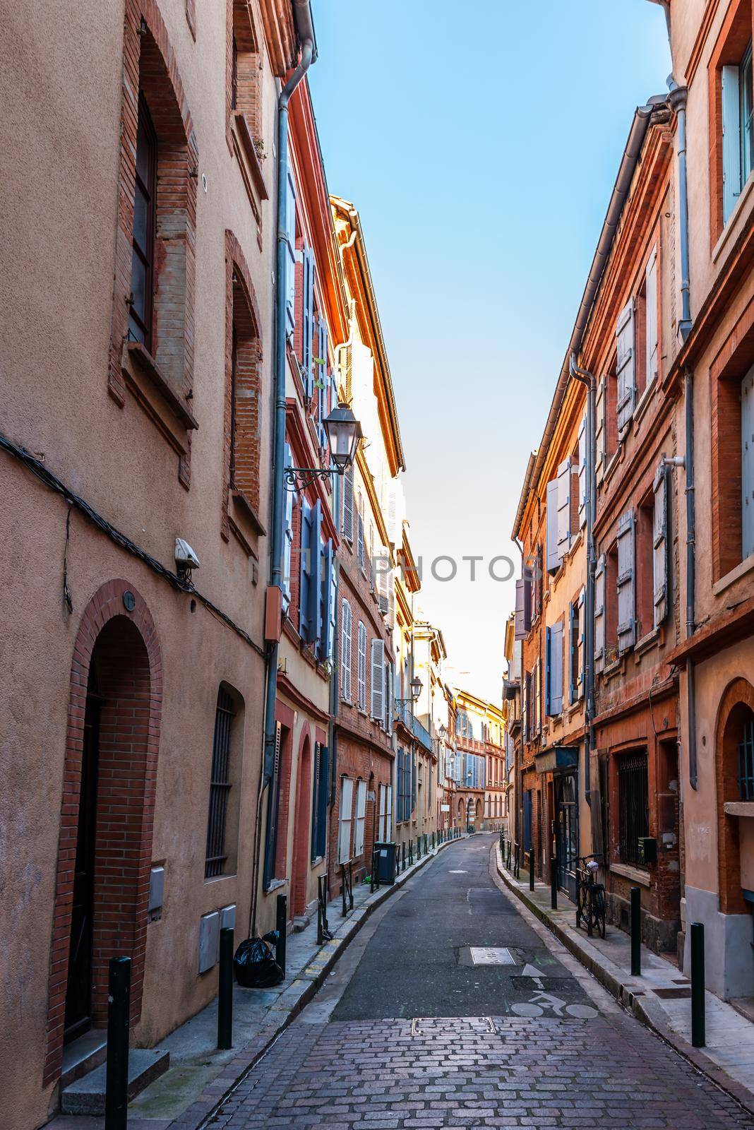 Typical street in Toulouse, Haute Garonne, Occitanie, France by Frederic