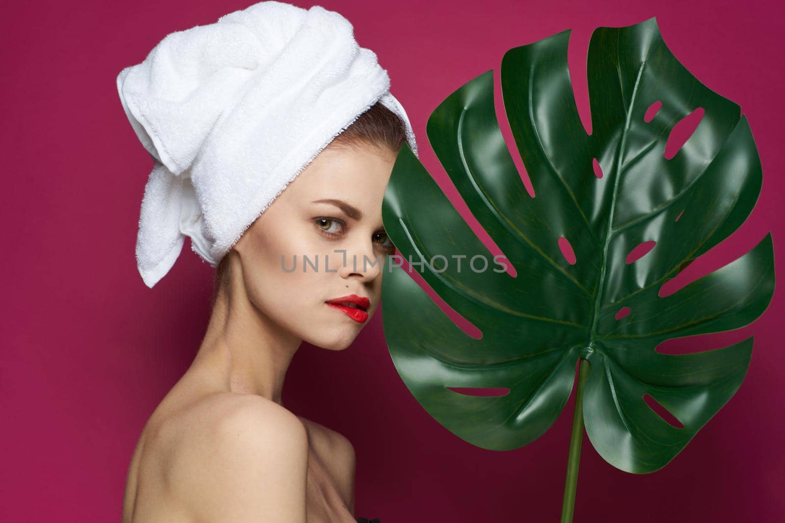 beautiful woman bare shoulders red lips posing spa treatments. High quality photo
