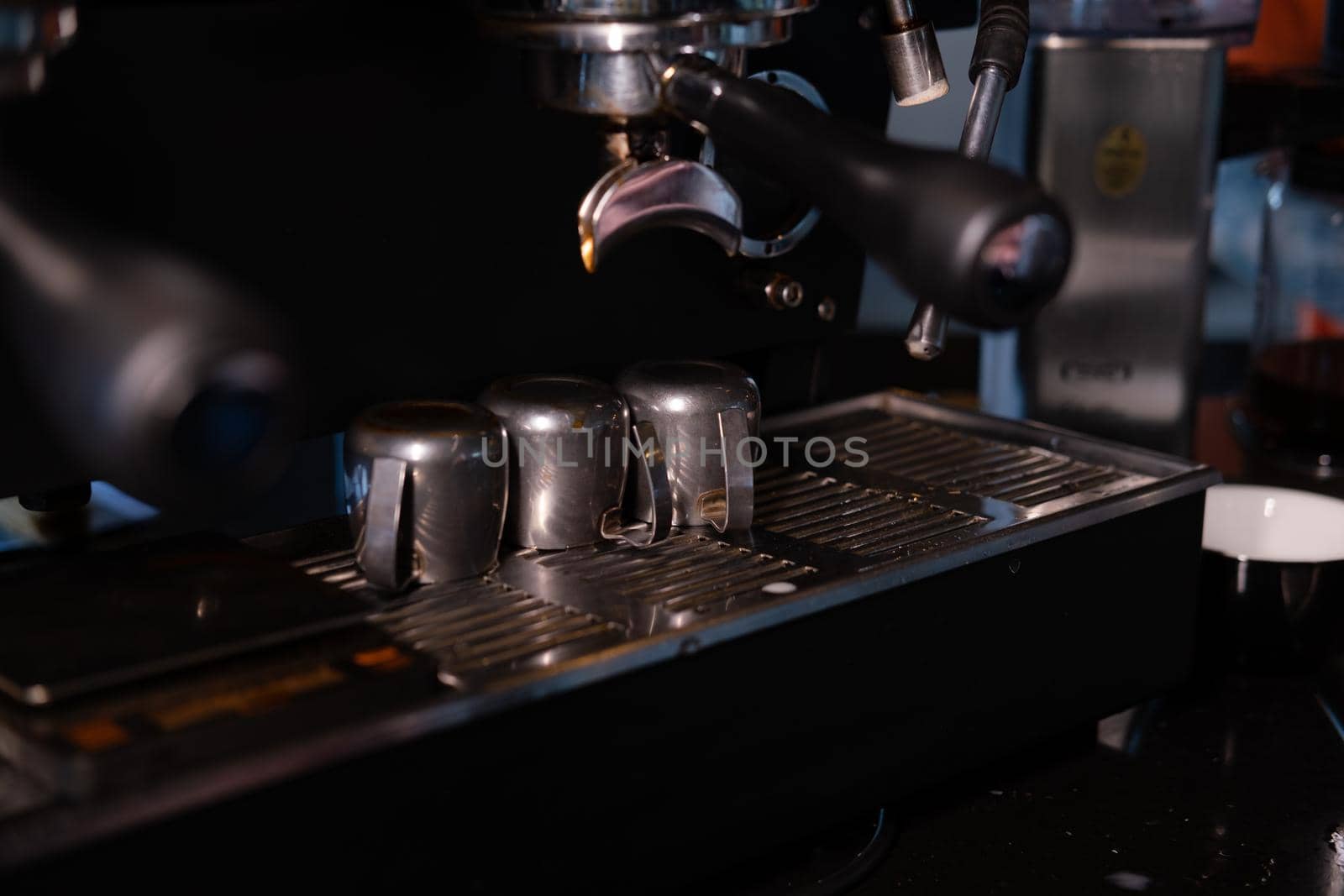 Close-up of Espresso machine making coffee in pub, bar, restaurant. Professional coffee brewing. Coffee Shop Cafeteria Restaurant Service Concept.