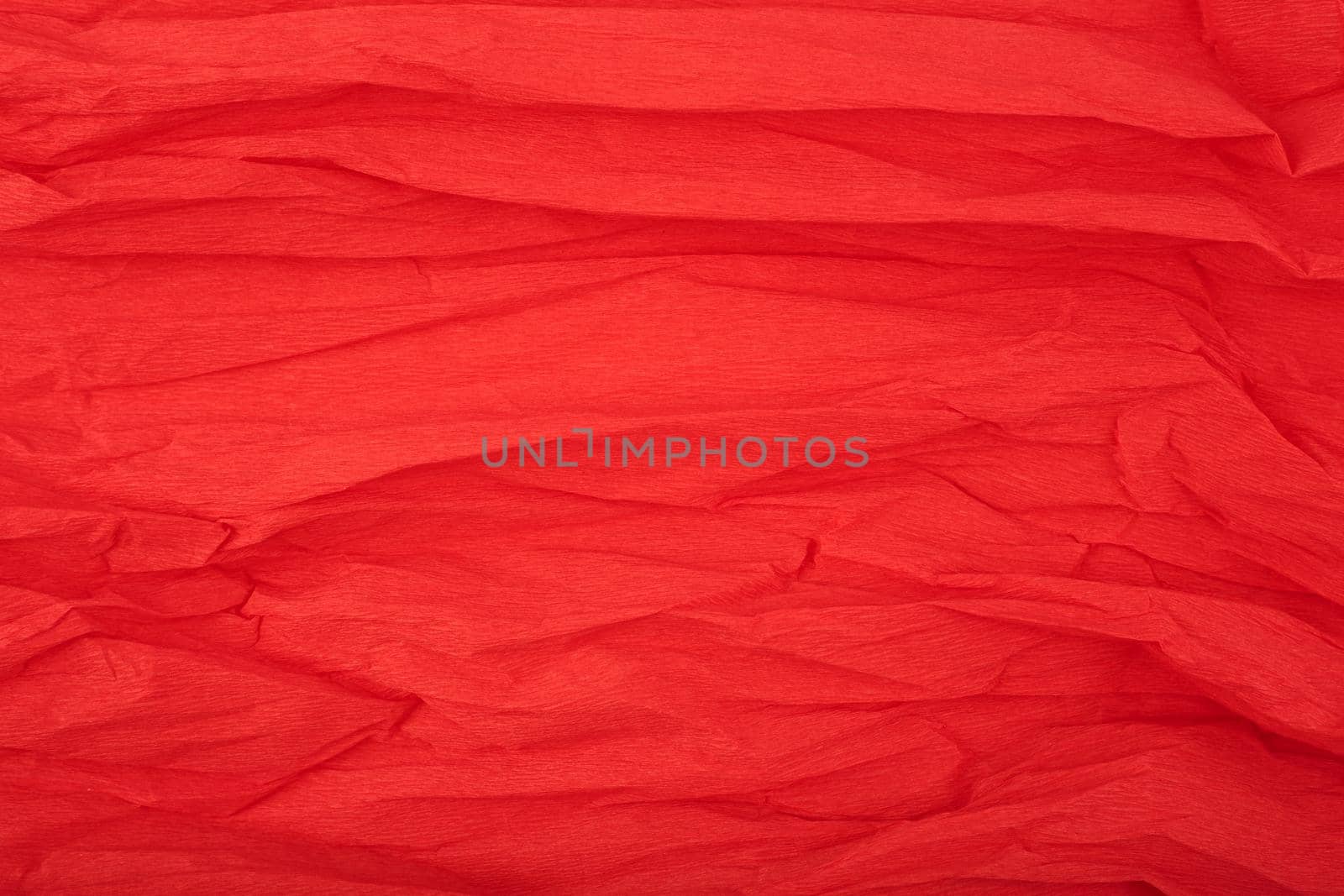 Red crumpled corrugated wrapping paper textured background with space for text by Senorina_Irina