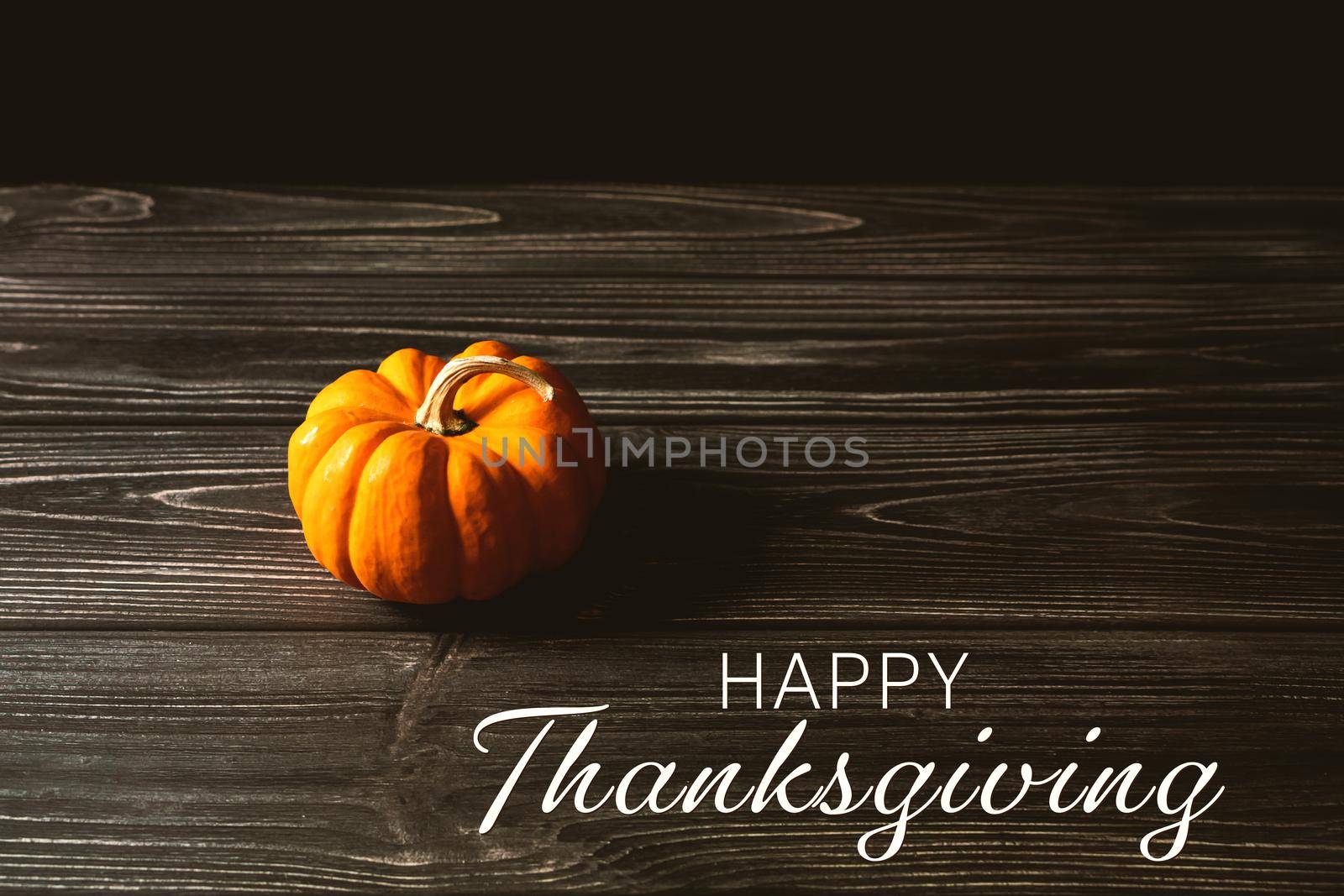 Happy Thanksgiving Day with pumpkin on wooden table by psodaz