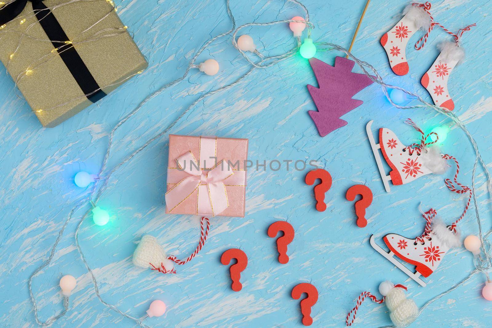 Choosing a gift for New Year or Christmas. Question mark. Choose a gift for the holiday.