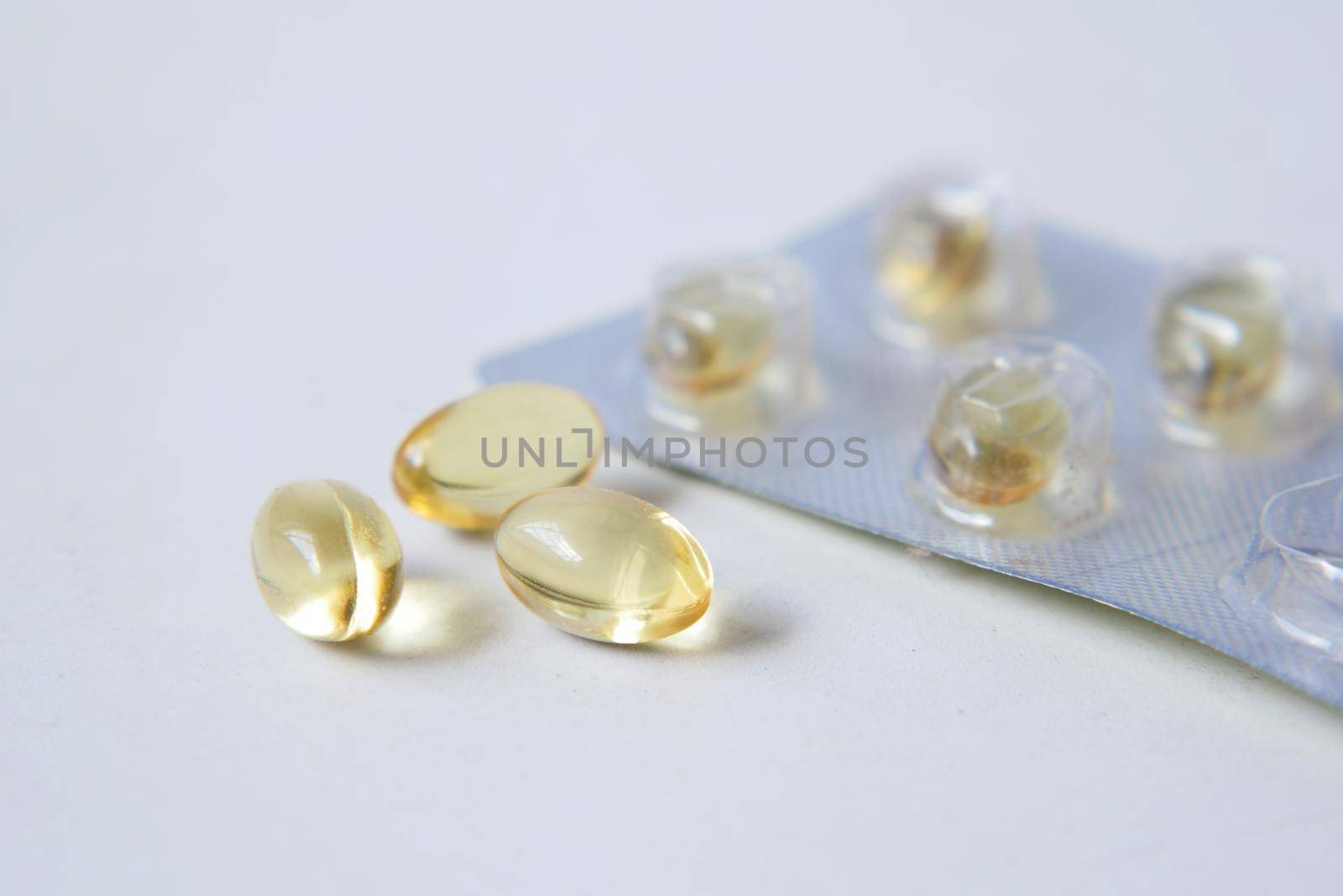 fish oil supplement on white background .