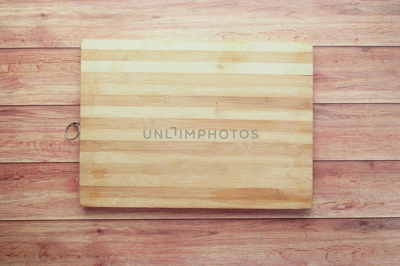 wooden chopping board on a table .