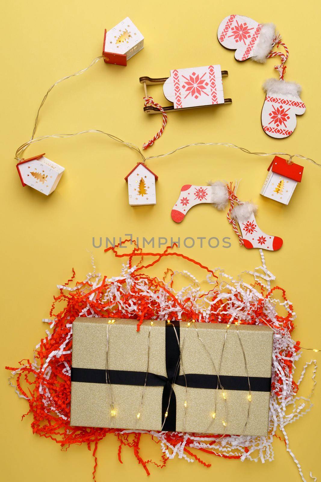 Christmas gift boxes. Happy New Year, Merry Christmas. Winter holiday theme. yellow background. Flat lay by darksoul72
