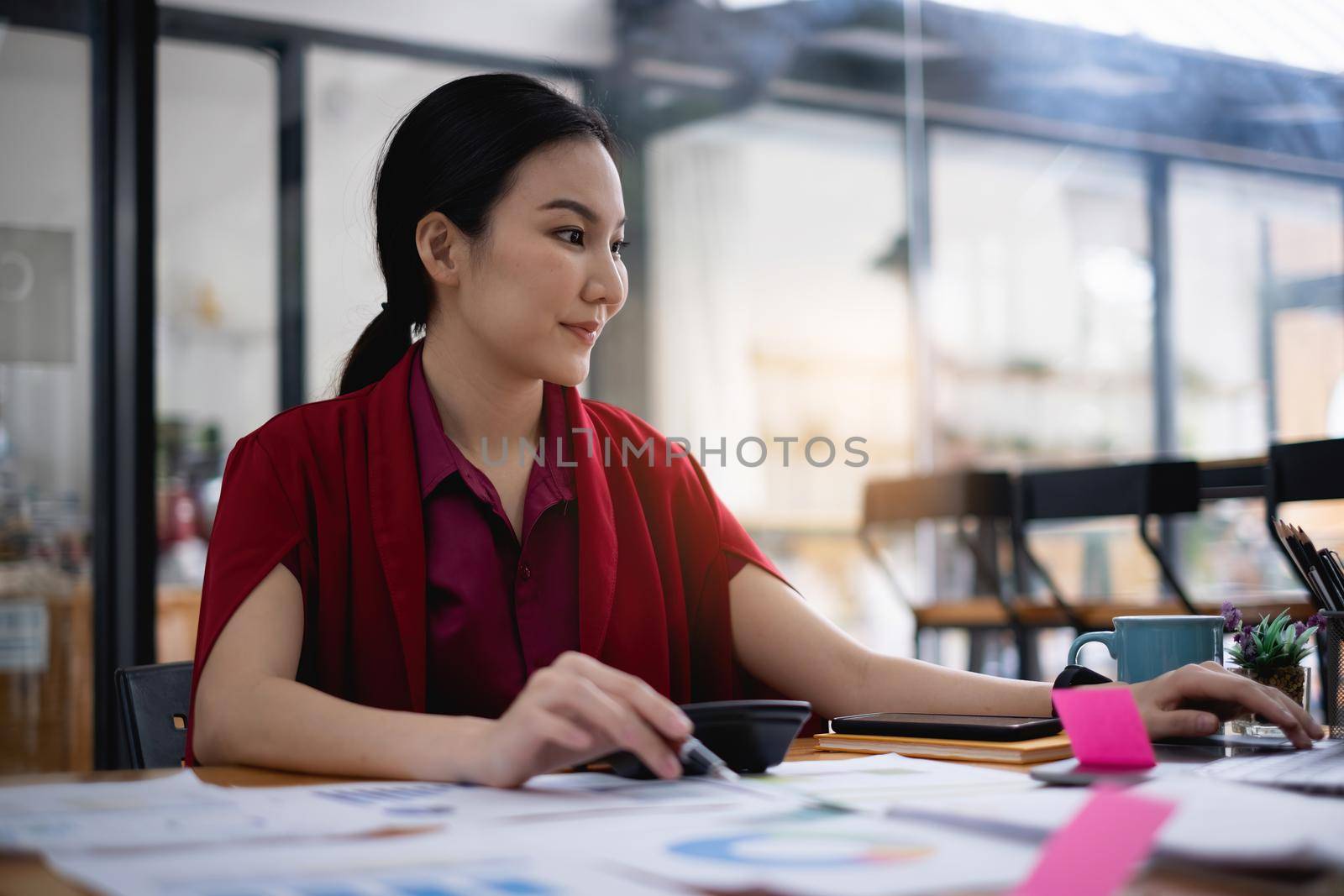 Young undergraduate student studying online class by laptop computer