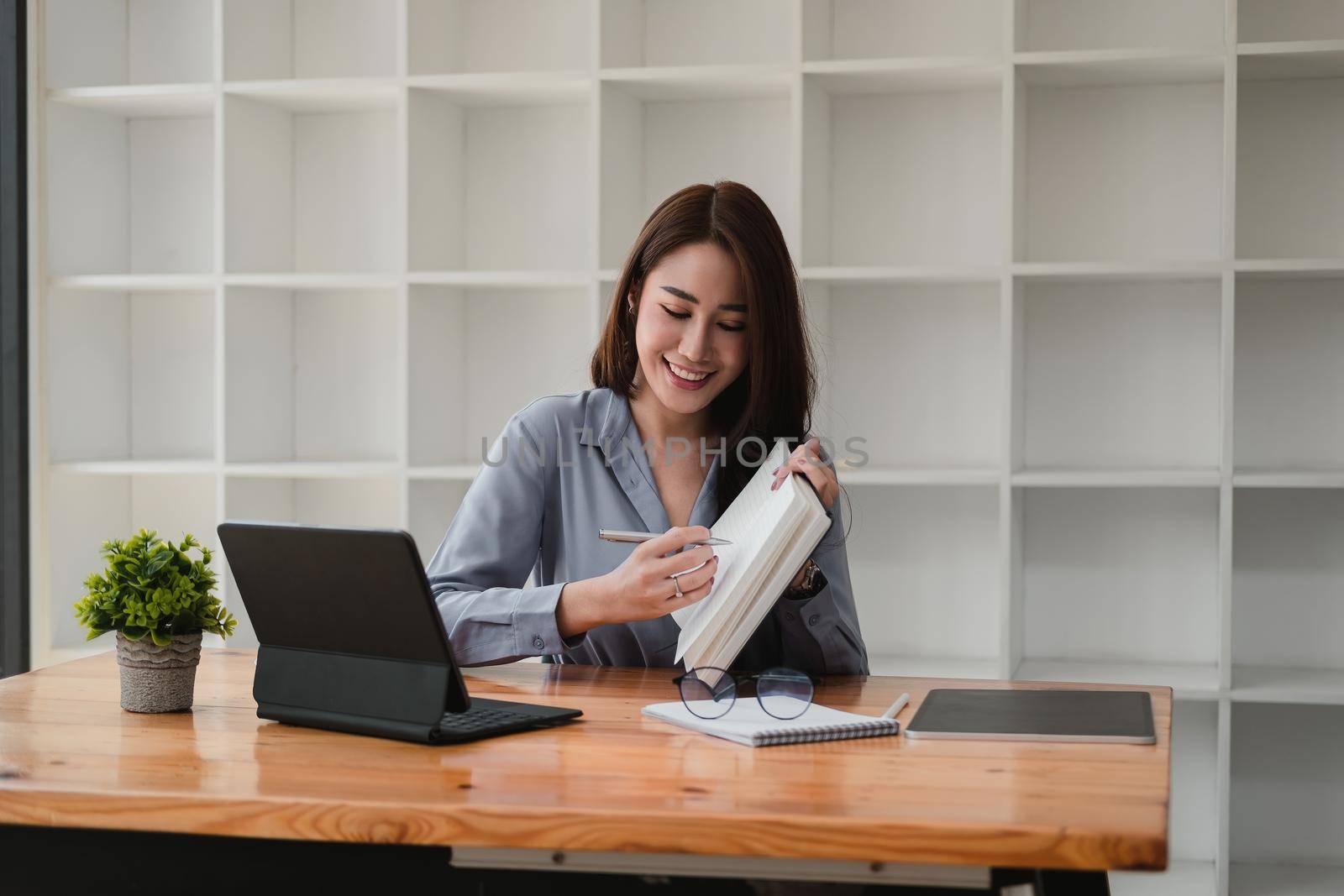 Young asian teacher giving online lessons video conference calling on digital tablet talk by webcam learn teach in online chat, distance webinar online teaching concept.