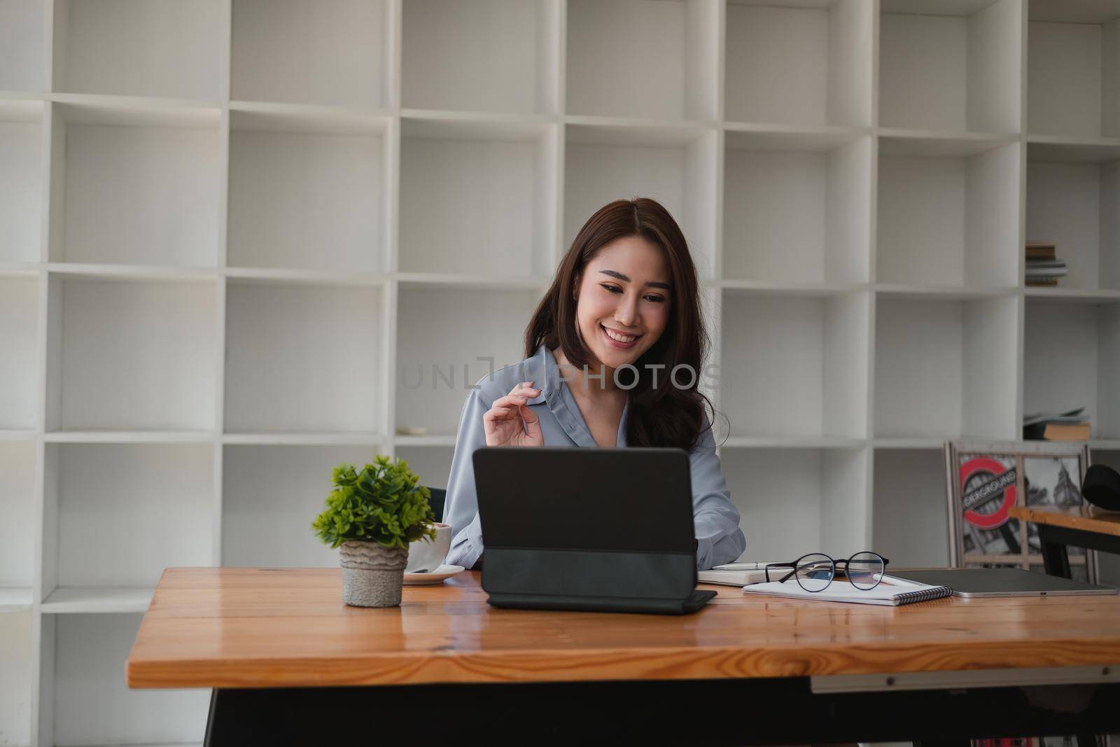 Young asian teacher giving online lessons video conference calling on digital tablet talk by webcam learn teach in online chat, distance webinar online teaching concept.