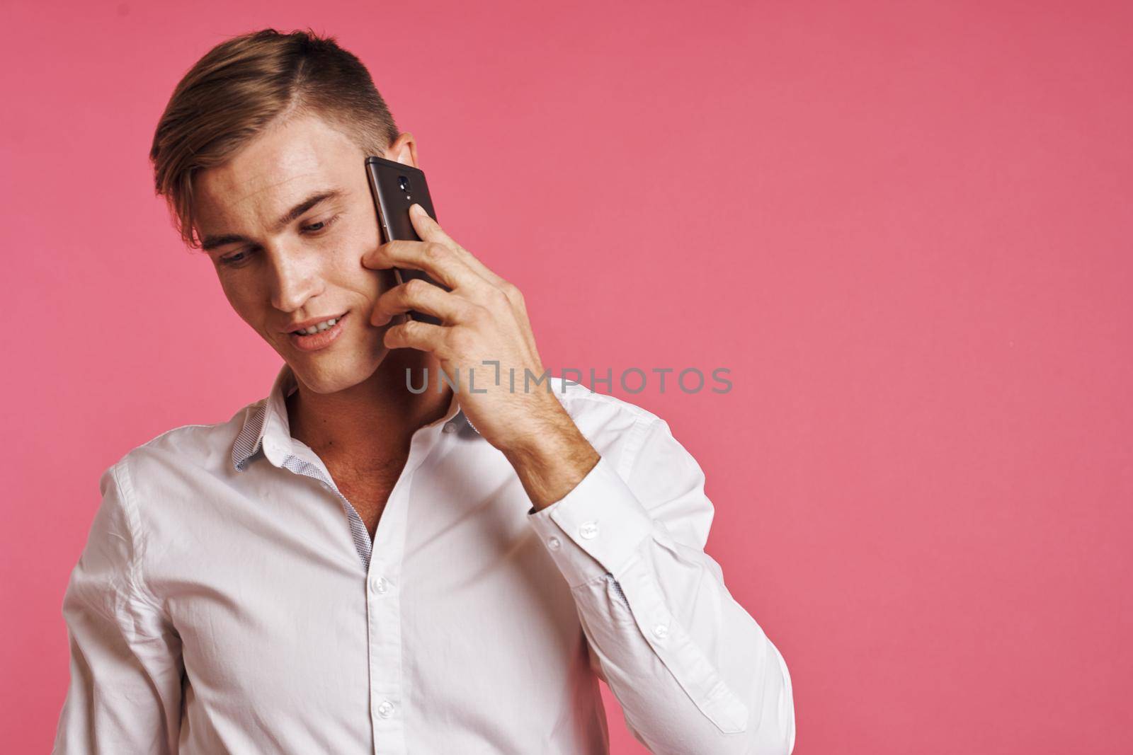 businessmen in a white shirt talking on the phone isolated background. High quality photo