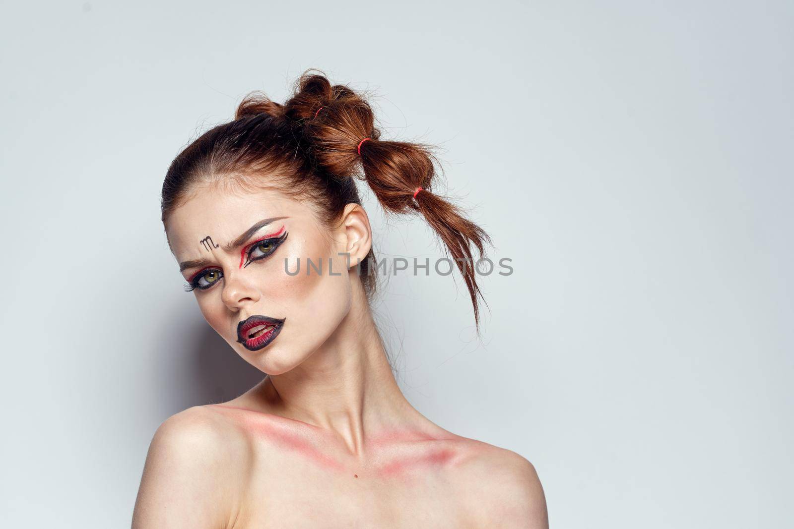 portrait of a woman Scorpion fashion glamor hairstyle studio model. High quality photo