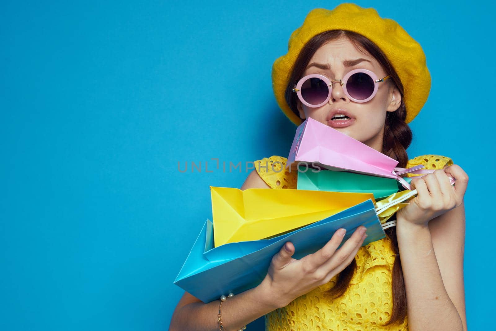 cheerful woman wearing sunglasses posing shopping fashion isolated background by Vichizh