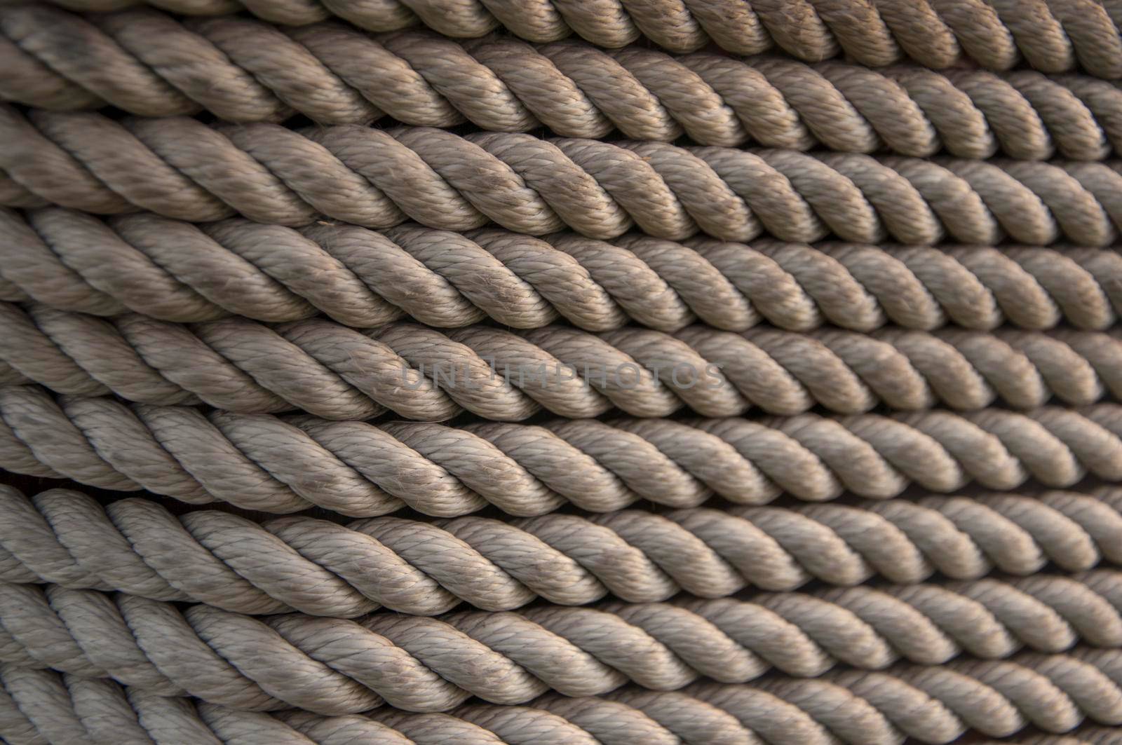 Hemp rope on weathered wood background