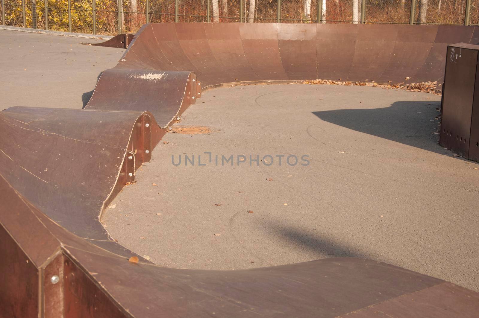 Skatepark ramps in the sunrise by inxti