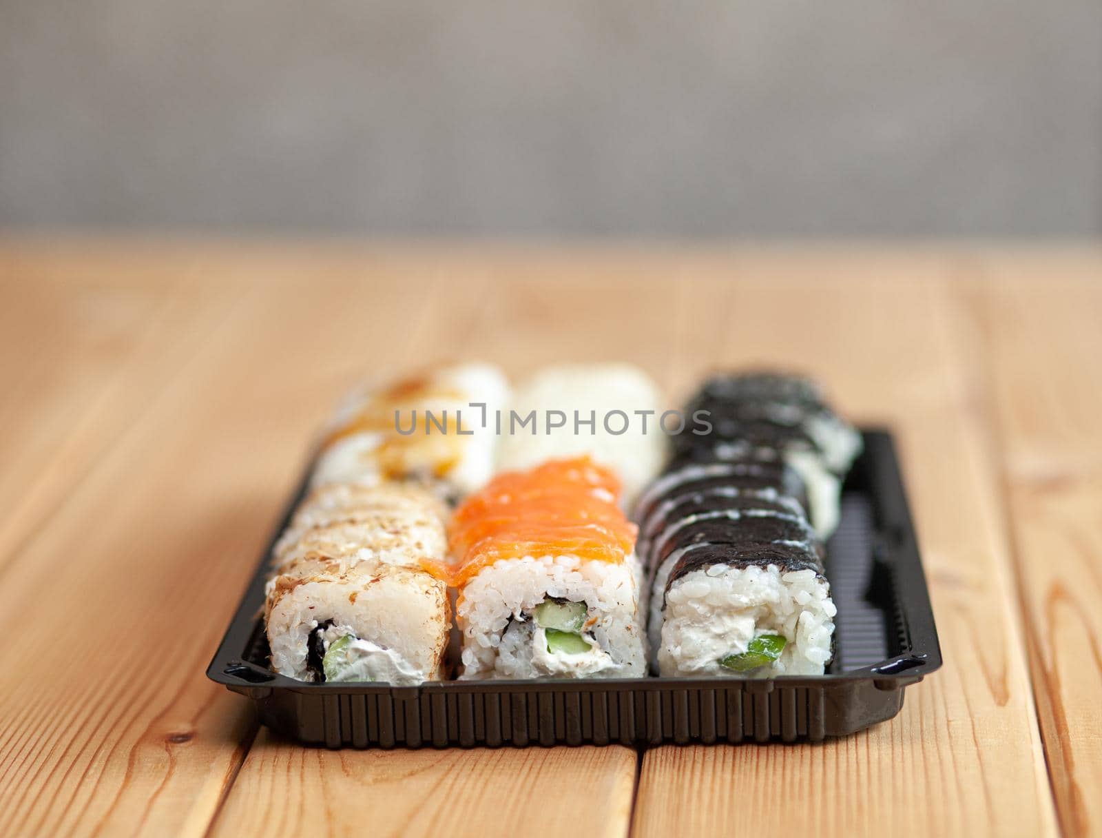 Making sushi and rolls at home. Sushi with seafood and white rice by AnatoliiFoto
