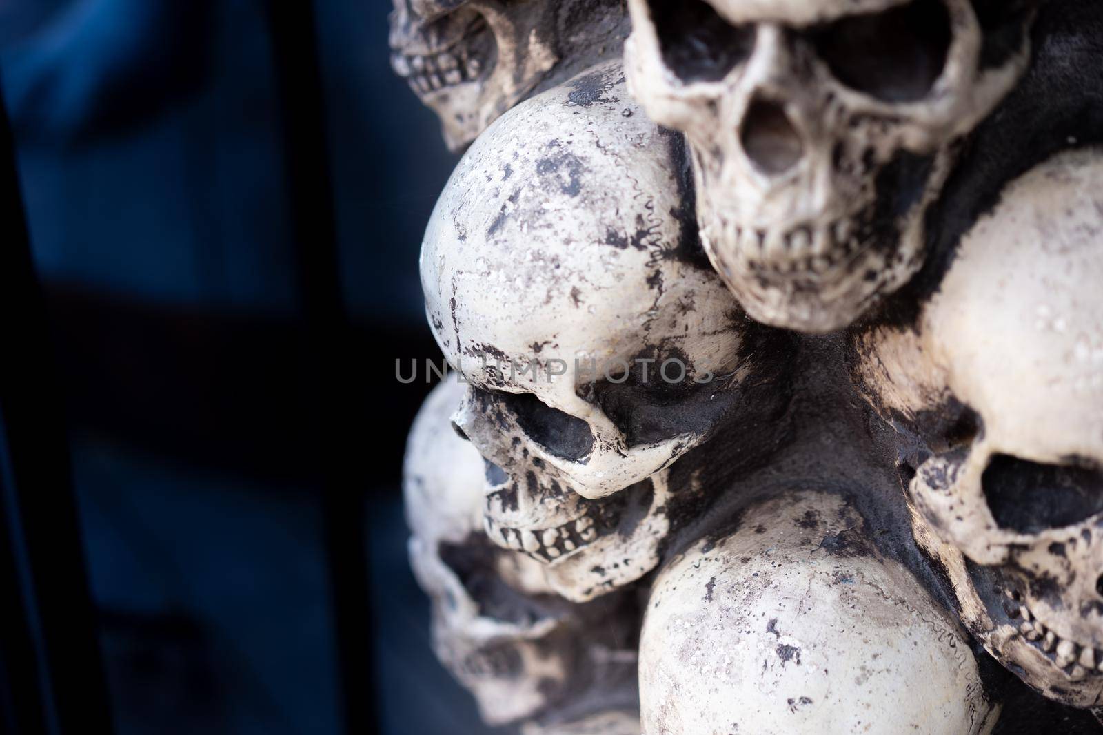 Skull Halloween Background Many People Skulls Stand on top of each other. Mystic creepy concept. Abstract nightmare occult memorial.
