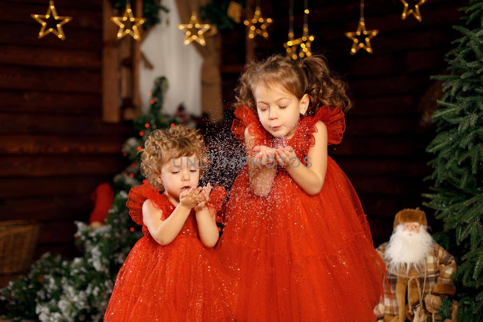 The child is excited about the Christmas holidays by throwing tinsel around by Try_my_best