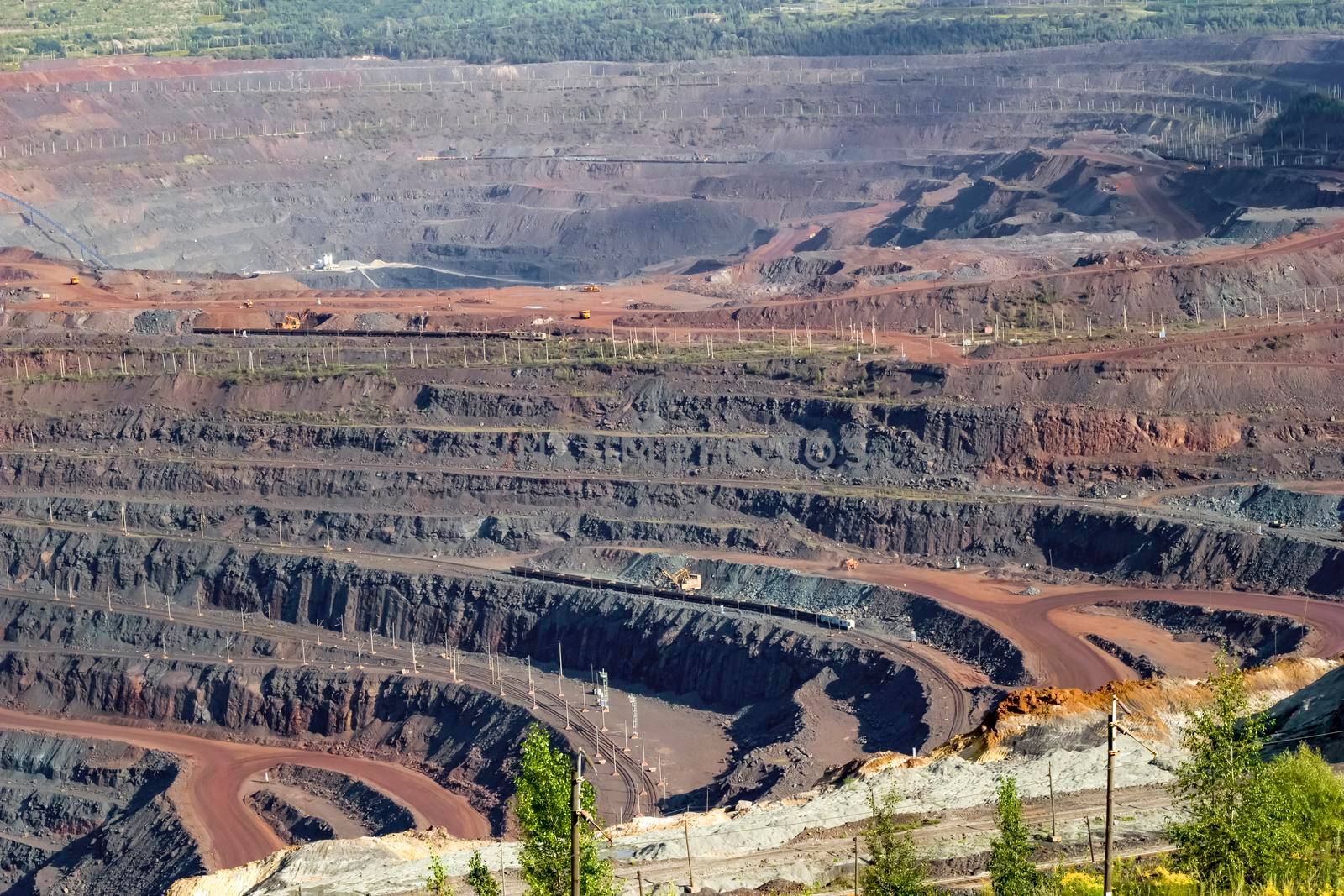 Panorama of an industrial mine for the extraction of natural resources, top view.