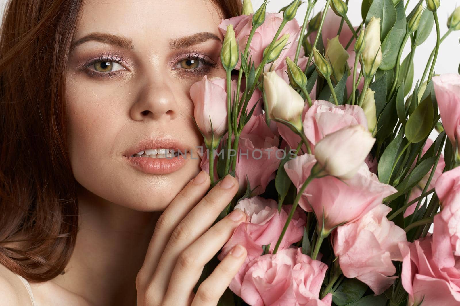 pretty woman flowers in hands posing charm lifestyle glamor. High quality photo