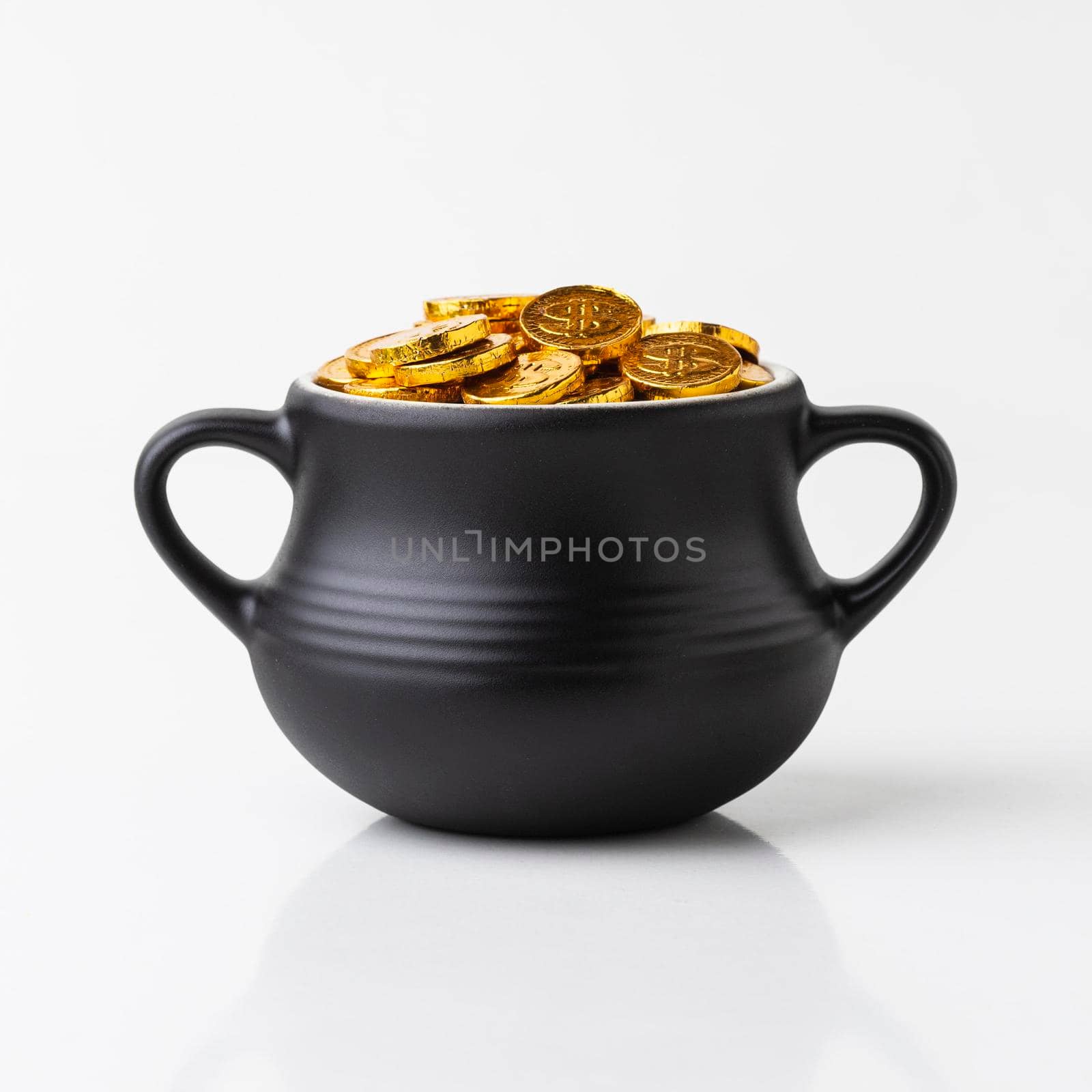 cauldron with gold coins arrangement. High resolution photo