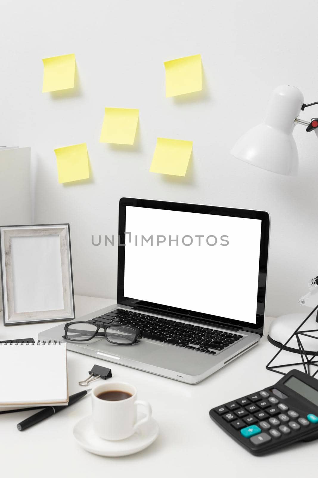 side view desk arrangement with post its wall. High quality photo by Zahard