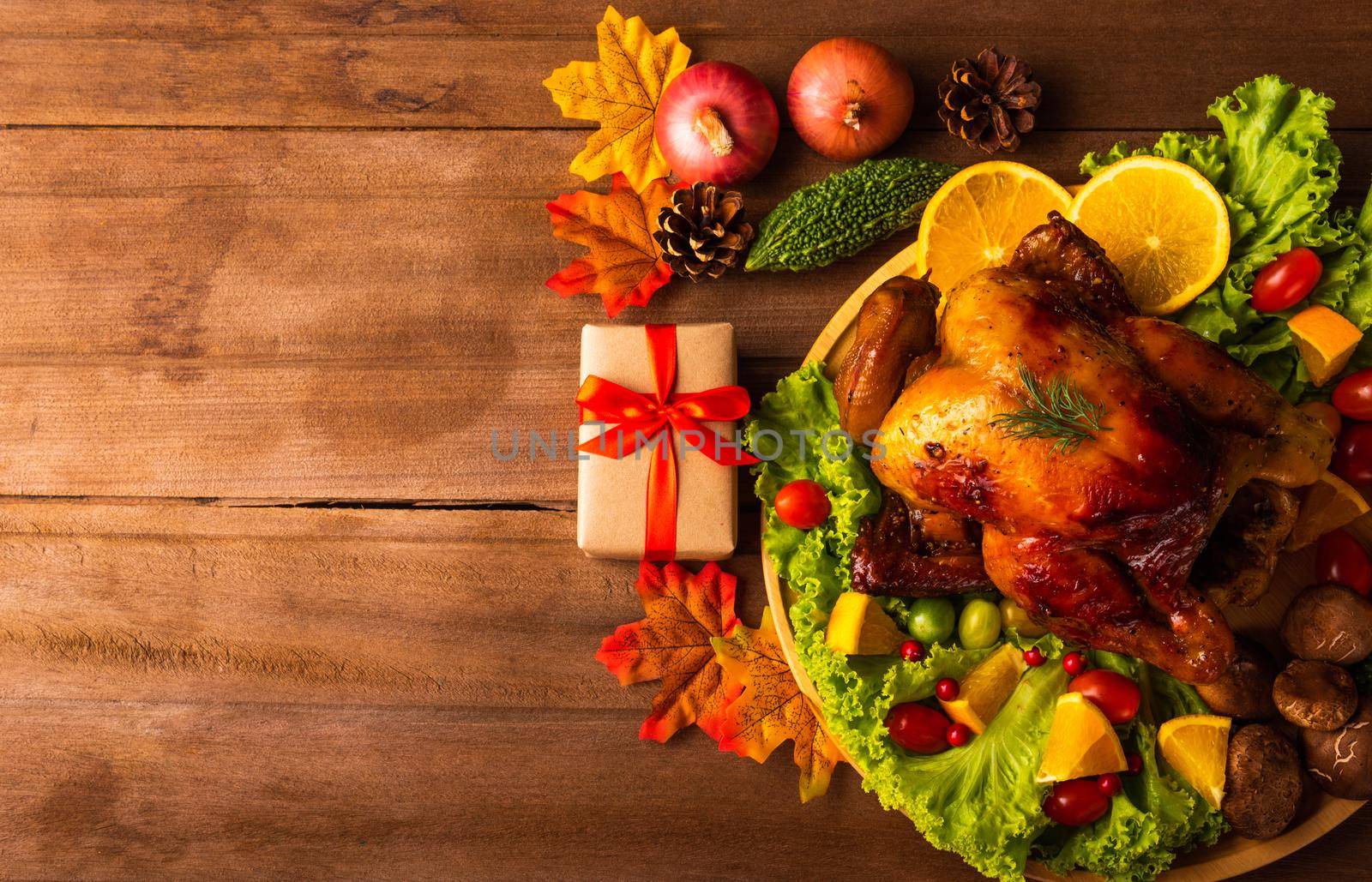 Thanksgiving roasted turkey or chicken and vegetables, Top view Christmas dinner feast food decoration traditional homemade on wooden table background, Happy thanksgiving day of holiday concept