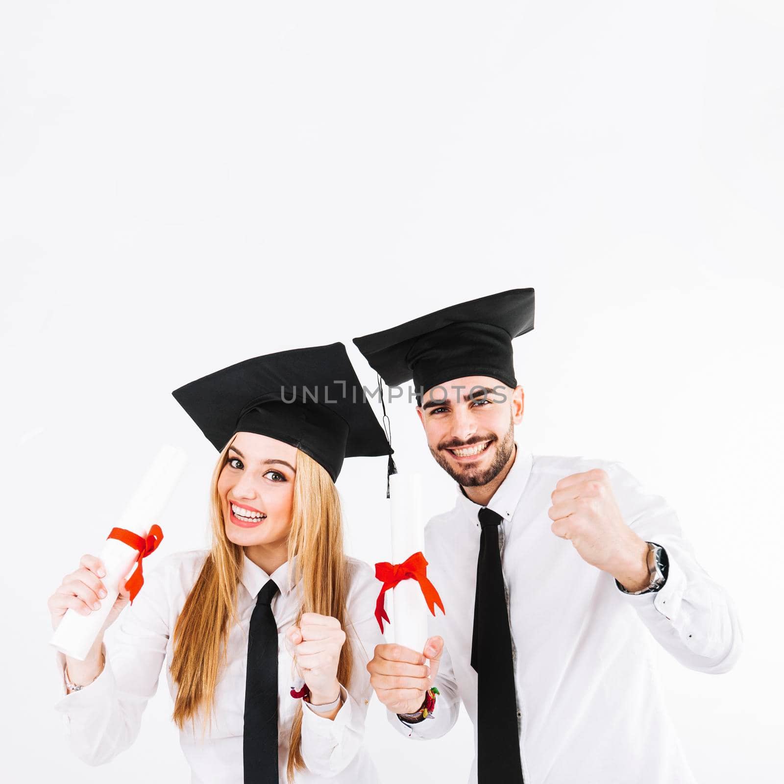 cheerful young graduating couple. High quality photo by Zahard