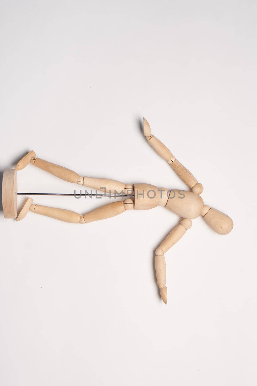 wooden mannequin object close up light background by Vichizh