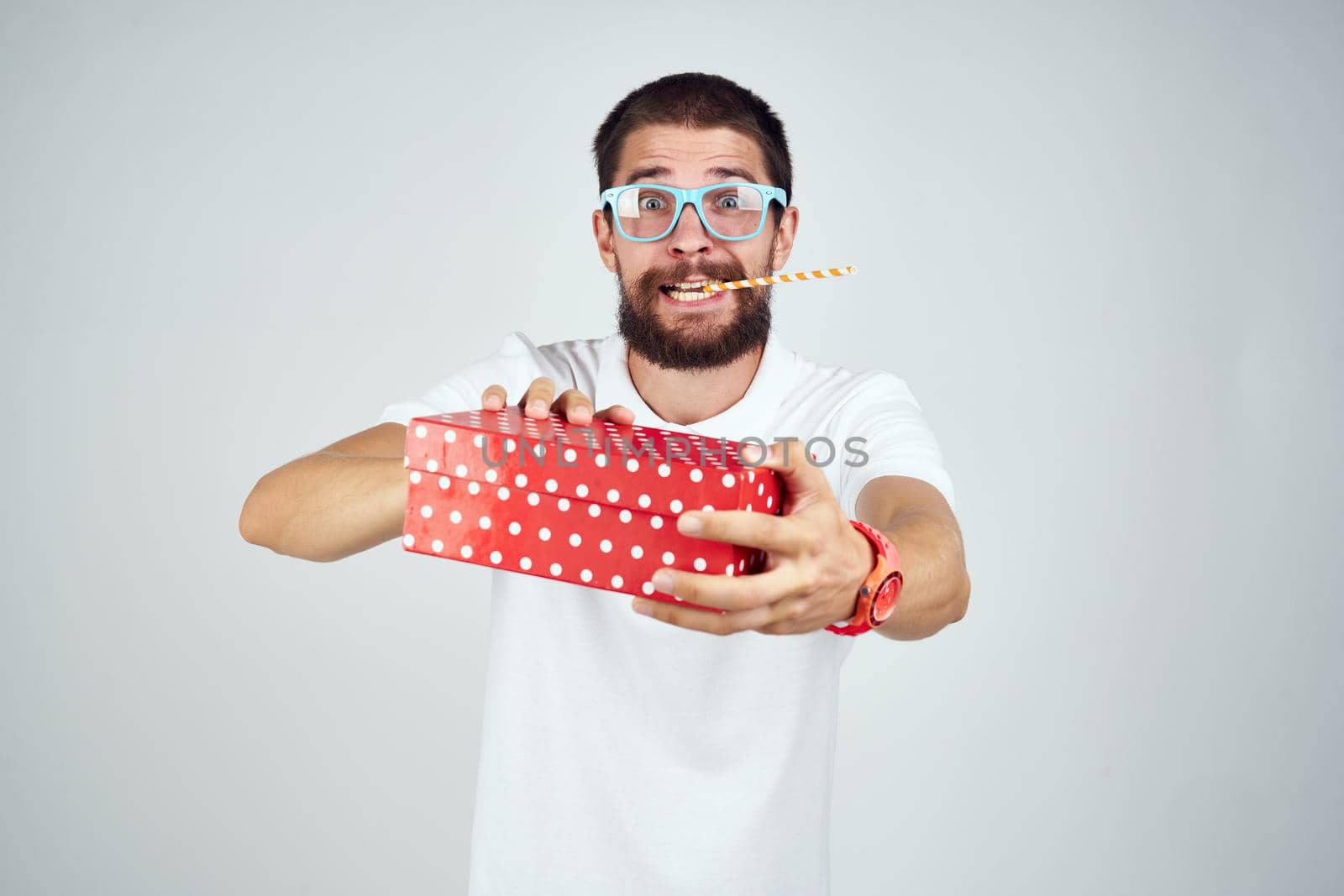 bearded man box with gift holiday fun birthday. High quality photo