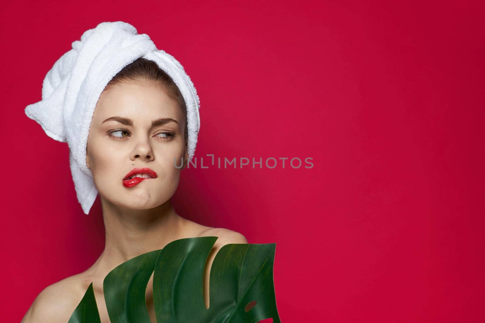 beautiful woman palm leaf bare shoulders clear skin studio model by Vichizh
