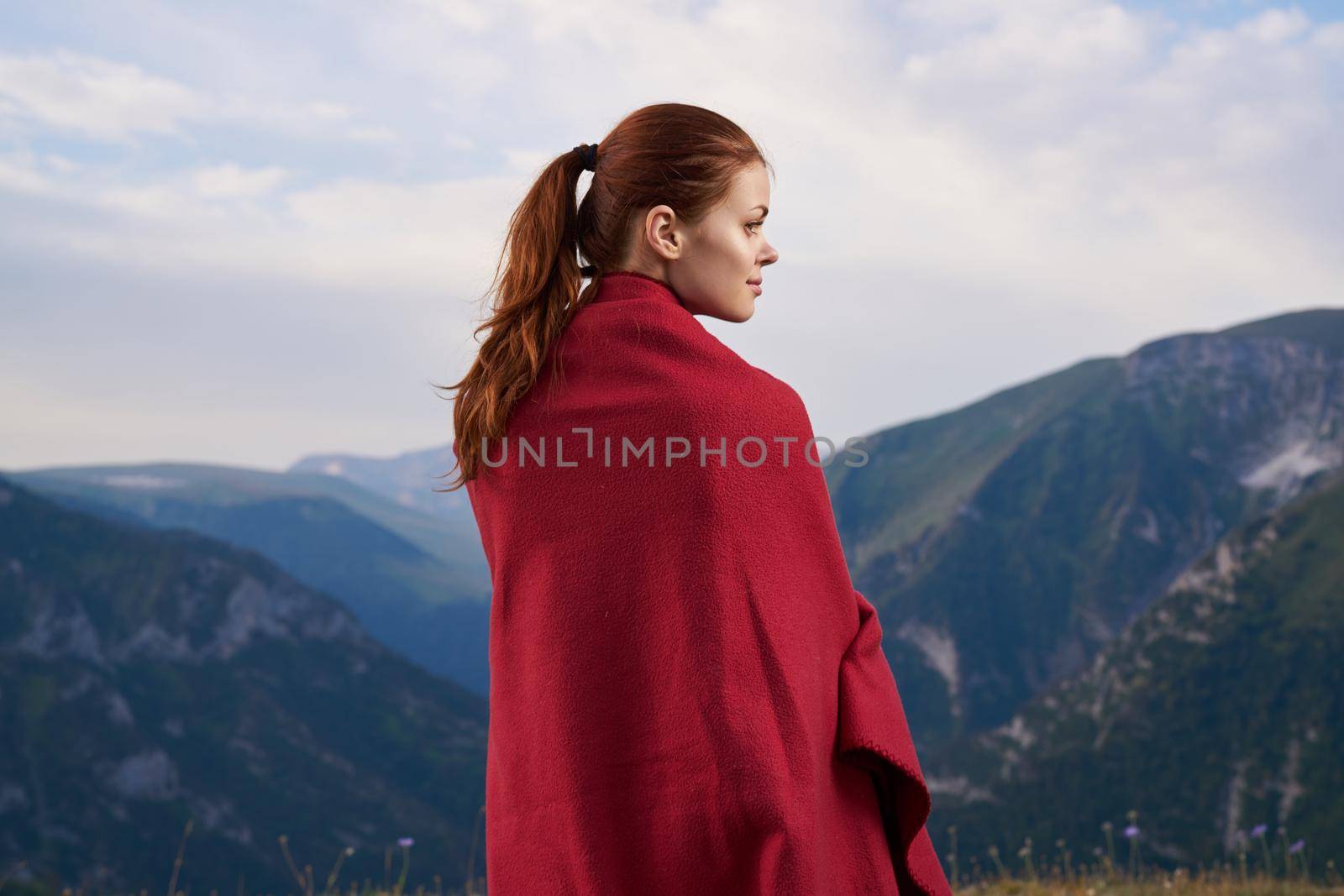 woman with red plaid on nature in the mountains vacation adventure by Vichizh