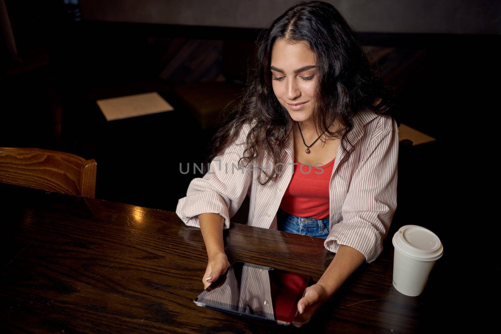 woman in cafe sits by the table morning rest breakfast Lifestyle. High quality photo