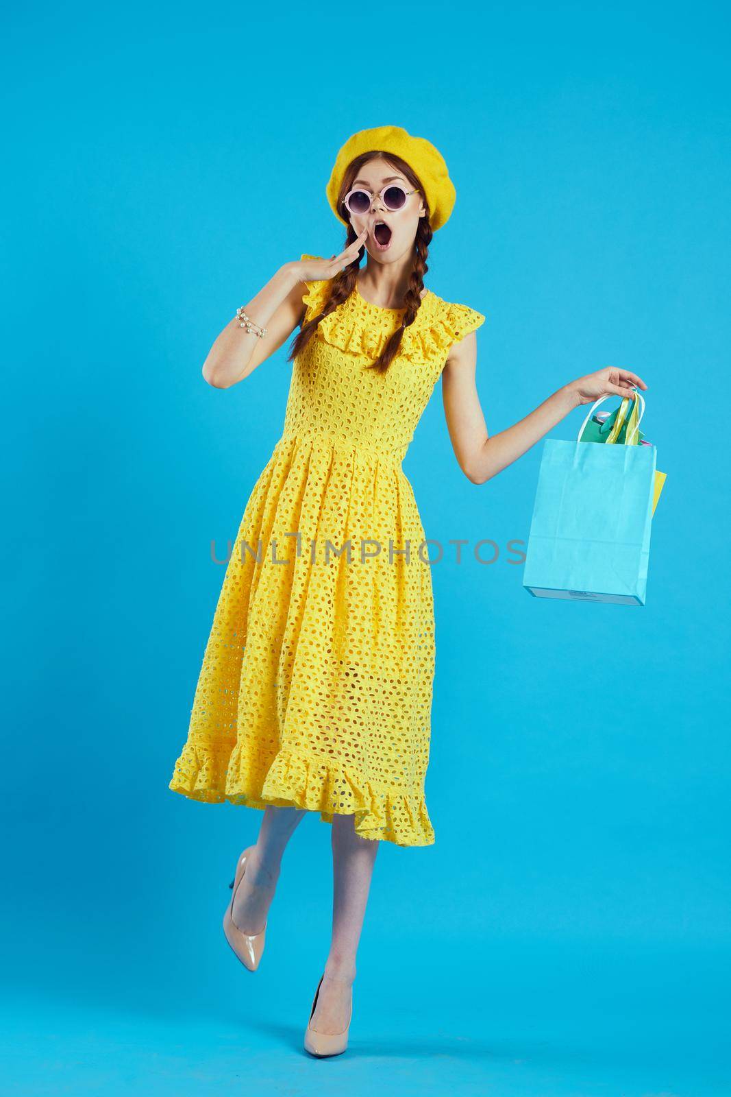 glamorous woman in a yellow hat Shopaholic fashion style isolated background by Vichizh