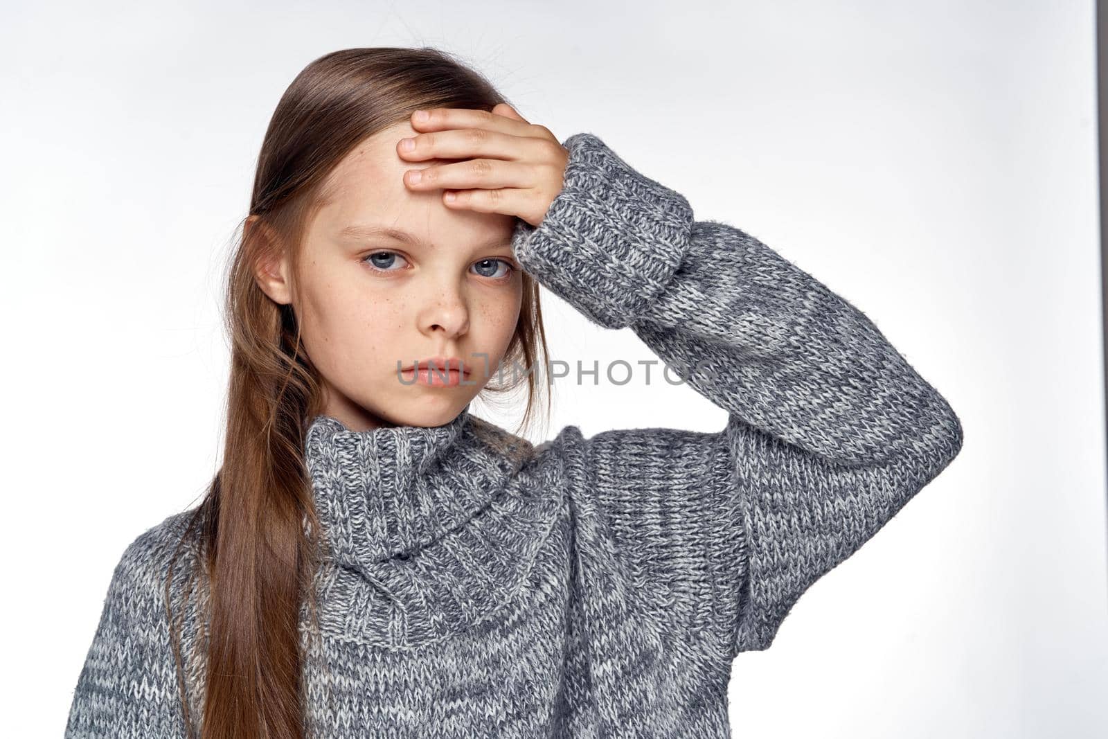 girl in sweater temperature health problems light background by Vichizh