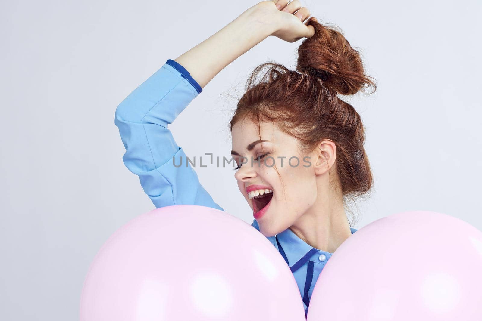 pretty woman with pigtails decoration holiday fun light background. High quality photo
