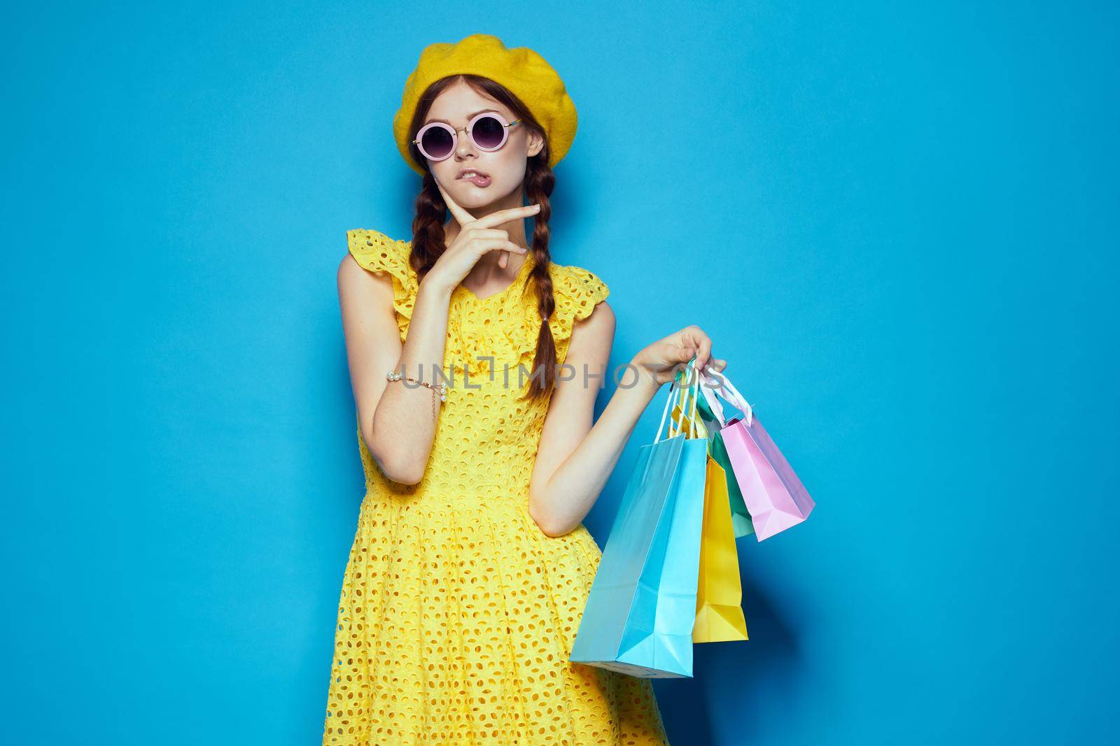 glamorous woman wearing sunglasses posing shopping fashion studio model by Vichizh