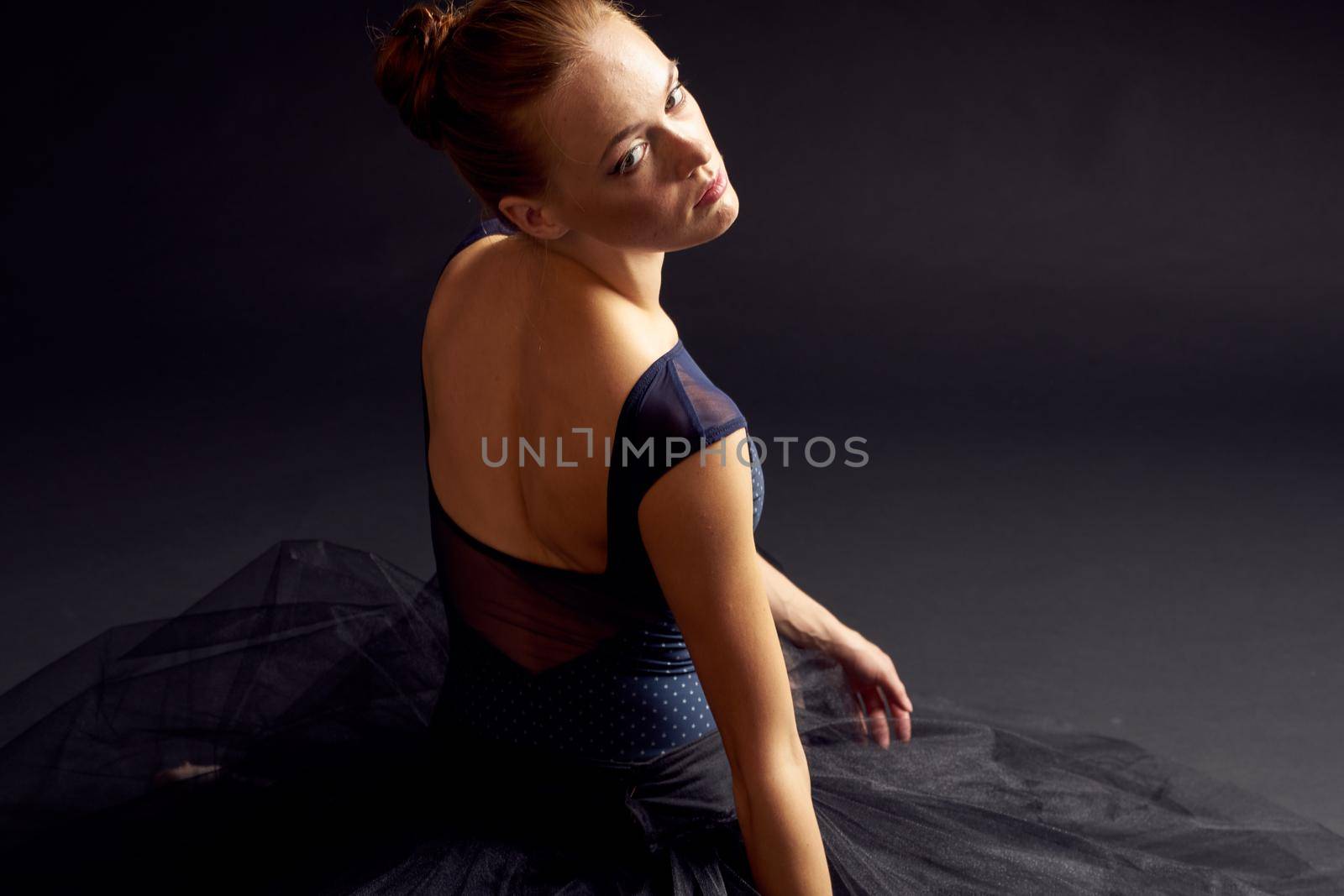 pretty woman in a black dress dance fashion exercise dark background by Vichizh