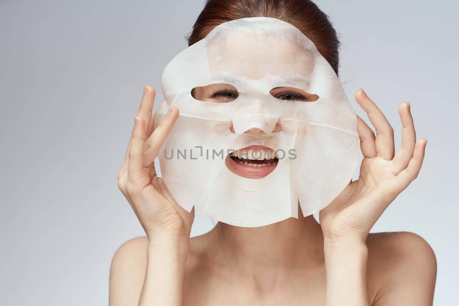 woman with bare shoulders face mask skin care procedures by Vichizh