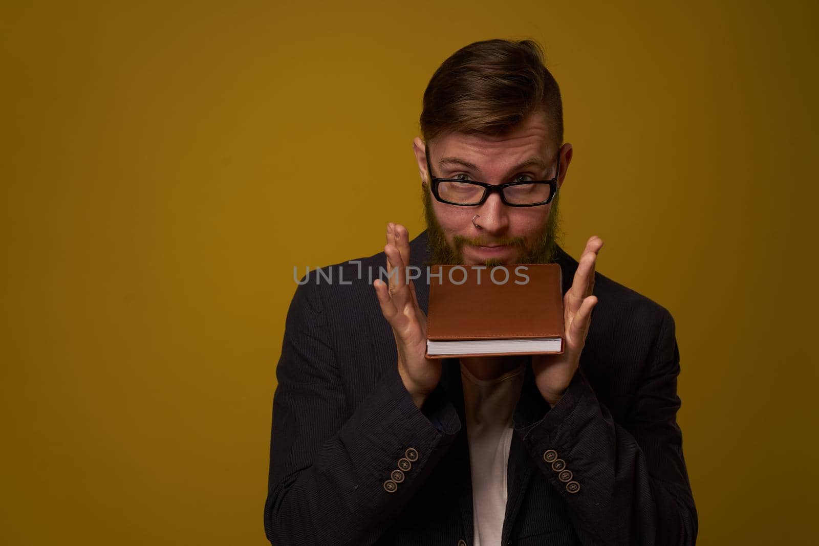 business man with glasses notepad in the hands of a studio official by Vichizh